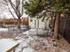View of backyard featuring an outdoor shed and large trees at 17973 E Iowa Dr, Aurora, CO 80017