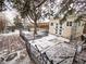 Landscaped backyard including a storage shed, a patio, and a garden area at 17973 E Iowa Dr, Aurora, CO 80017