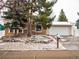 Charming two-story brick home featuring a two-car garage and well-manicured front yard at 17973 E Iowa Dr, Aurora, CO 80017
