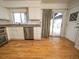 Kitchen includes stainless steel appliances and an exterior door that provides outdoor access at 17973 E Iowa Dr, Aurora, CO 80017