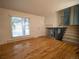 Inviting living room features hardwood floors, a staircase, and plenty of natural light at 17973 E Iowa Dr, Aurora, CO 80017