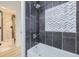 Modern bathroom featuring decorative tile and bathtub at 621 Campo St, Denver, CO 80221