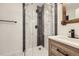 Bathroom featuring new frameless shower with neutral tile and updated vanity at 621 Campo St, Denver, CO 80221