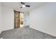 Bedroom featuring barn door to ensuite bathroom at 621 Campo St, Denver, CO 80221