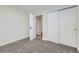 Bedroom featuring neutral carpet and closet at 621 Campo St, Denver, CO 80221