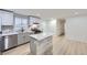 Stylish kitchen with island, gray cabinets, and modern finishes at 621 Campo St, Denver, CO 80221