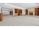Finished basement features custom wood built-ins and a brick fireplace at 96 Falcon Hills Dr, Highlands Ranch, CO 80126