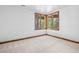 Bright, carpeted bedroom with large windows offering natural light and pleasant views at 96 Falcon Hills Dr, Highlands Ranch, CO 80126