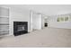 Bedroom with a fireplace and large window allowing natural light at 96 Falcon Hills Dr, Highlands Ranch, CO 80126