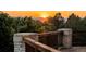 Back deck providing beautiful views of the setting sun over the mountains at 96 Falcon Hills Dr, Highlands Ranch, CO 80126