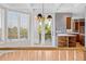 Sun-drenched dining area offers access to a deck and kitchen with butcher block counters and custom cabinets at 96 Falcon Hills Dr, Highlands Ranch, CO 80126