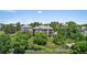 Aerial view of a home surrounded by green trees and manicured lawns at 96 Falcon Hills Dr, Highlands Ranch, CO 80126