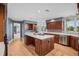 Gourmet kitchen showcases custom cabinets, a large island, and stainless steel appliances at 96 Falcon Hills Dr, Highlands Ranch, CO 80126