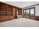Office with custom wood built-ins and direct access to the outside at 96 Falcon Hills Dr, Highlands Ranch, CO 80126