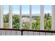 Stunning view from a large window overlooking the surrounding landscape and distant mountains at 96 Falcon Hills Dr, Highlands Ranch, CO 80126