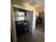 Laundry closet area featuring a washer and dryer plus extra shelving at 5255 Memphis St # 121, Denver, CO 80239