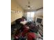 Bright living room featuring a fireplace, sliding glass doors, and ceiling fan at 5255 Memphis St # 121, Denver, CO 80239