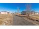 Spacious property with a long driveway, detached garage, and two mobile homes at 501 Zante Way, Lochbuie, CO 80603