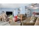 Cozy living room featuring light blue walls, comfortable sofas, and a large TV at 501 Zante Way, Lochbuie, CO 80603