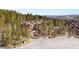 Aerial view of condo building surrounded by mountains and trees at 107 Skiwatch Dr # 329, Breckenridge, CO 80424