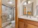 Bathroom with vanity and glass enclosed shower with tile surround at 107 Skiwatch Dr # 329, Breckenridge, CO 80424