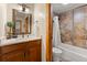 Bathroom with vanity and shower with tile surround at 107 Skiwatch Dr # 329, Breckenridge, CO 80424