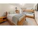 Cozy bedroom featuring a queen bed, bunk beds, and wood furnishings at 107 Skiwatch Dr # 329, Breckenridge, CO 80424