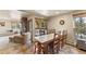 Bright dining area with large table, seating for eight, and seamless transition to the cozy living room at 107 Skiwatch Dr # 329, Breckenridge, CO 80424