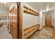 Functional entryway features built-in bench, coat hooks, and storage, blending practicality with rustic charm at 107 Skiwatch Dr # 329, Breckenridge, CO 80424