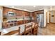 Well-equipped kitchen featuring stainless steel appliances, wooden cabinets, and an adjacent dining area at 107 Skiwatch Dr # 329, Breckenridge, CO 80424
