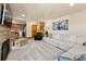 Spacious living room featuring a stone fireplace, comfortable seating, and seamless access to the kitchen at 107 Skiwatch Dr # 329, Breckenridge, CO 80424