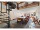 Cozy lounge area with a long table and a spiral staircase at 107 Skiwatch Dr # 329, Breckenridge, CO 80424