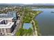 Scenic aerial view of tennis courts near green parks and lakeside living, providing an active and picturesque lifestyle at 4200 W 17Th Ave # 611, Denver, CO 80204
