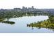 Panoramic aerial view of lake near Denver skyline, showcasing the surrounding green spaces and cityscape at 4200 W 17Th Ave # 611, Denver, CO 80204