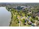 Scenic aerial view of a waterfront community with lush green spaces, playgrounds, and access to walking trails at 4200 W 17Th Ave # 611, Denver, CO 80204