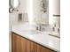 Modern bathroom vanity with a sleek countertop, stylish faucet, and wood cabinetry at 4200 W 17Th Ave # 611, Denver, CO 80204