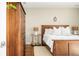 Bedroom with warm lighting, hardwood floors, and stylish decor at 4200 W 17Th Ave # 611, Denver, CO 80204