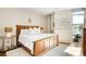 Bright bedroom with a large bed, stylish lighting and natural light at 4200 W 17Th Ave # 611, Denver, CO 80204