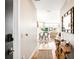 Inviting hallway leading to a dining and living area with bright, natural light at 4200 W 17Th Ave # 611, Denver, CO 80204
