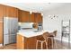 Well-appointed kitchen with wooden cabinets, stainless steel appliances, and a large island at 4200 W 17Th Ave # 611, Denver, CO 80204