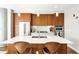 Modern kitchen boasts wooden cabinetry, stainless steel appliances, and a spacious island with seating at 4200 W 17Th Ave # 611, Denver, CO 80204