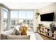 Cozy living room with floor-to-ceiling windows offering ample natural light and city views at 4200 W 17Th Ave # 611, Denver, CO 80204