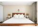 Cozy main bedroom with lamps on either side of the bed at 4200 W 17Th Ave # 611, Denver, CO 80204