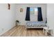 Cozy bedroom with natural light and wood floor at 3355 Talisman Ct # C, Boulder, CO 80301
