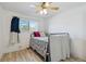 Bright bedroom features a ceiling fan, window, and vinyl wood flooring at 3355 Talisman Ct # C, Boulder, CO 80301