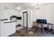 Open kitchen layout with tiled flooring, bar seating, white cabinets and natural light at 3355 Talisman Ct # C, Boulder, CO 80301