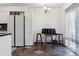 Open kitchen layout with tiled flooring, bar seating and natural light at 3355 Talisman Ct # C, Boulder, CO 80301