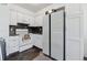Bright kitchen with white cabinets, modern appliances, and tiled backsplash at 3355 Talisman Ct # C, Boulder, CO 80301