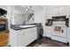 Charming kitchen with white cabinets, laundry, and open design at 3355 Talisman Ct # C, Boulder, CO 80301