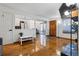Open living space features hardwood floors, fireplace and flatscreen TV plus kitchen, dining and front door access at 3355 Talisman Ct # C, Boulder, CO 80301